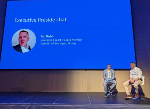 Ian Bubb on stage during an executive fireside chat at FintechOS Elevate in November 2025