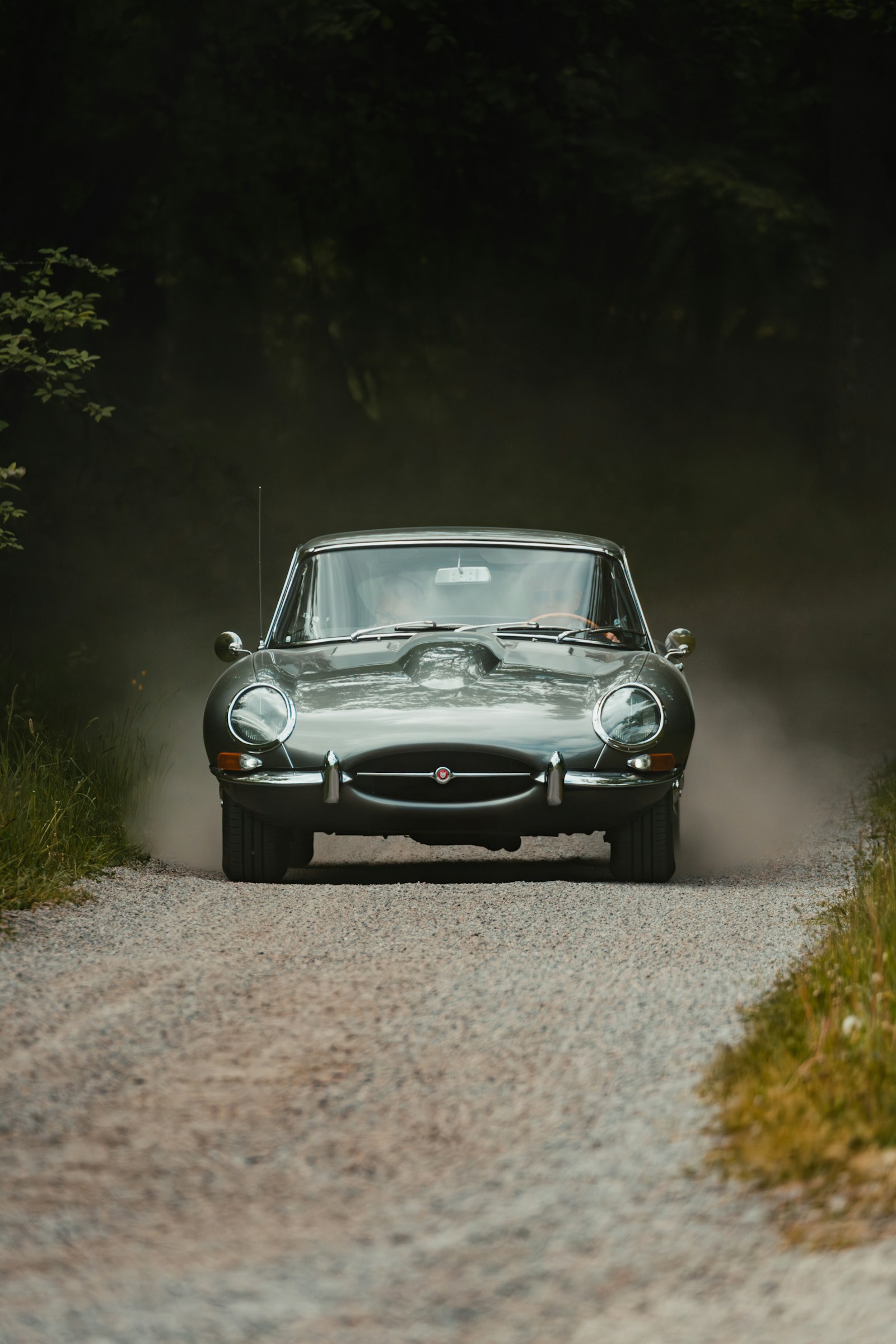 Classic Jaguar E-Type on a country lane